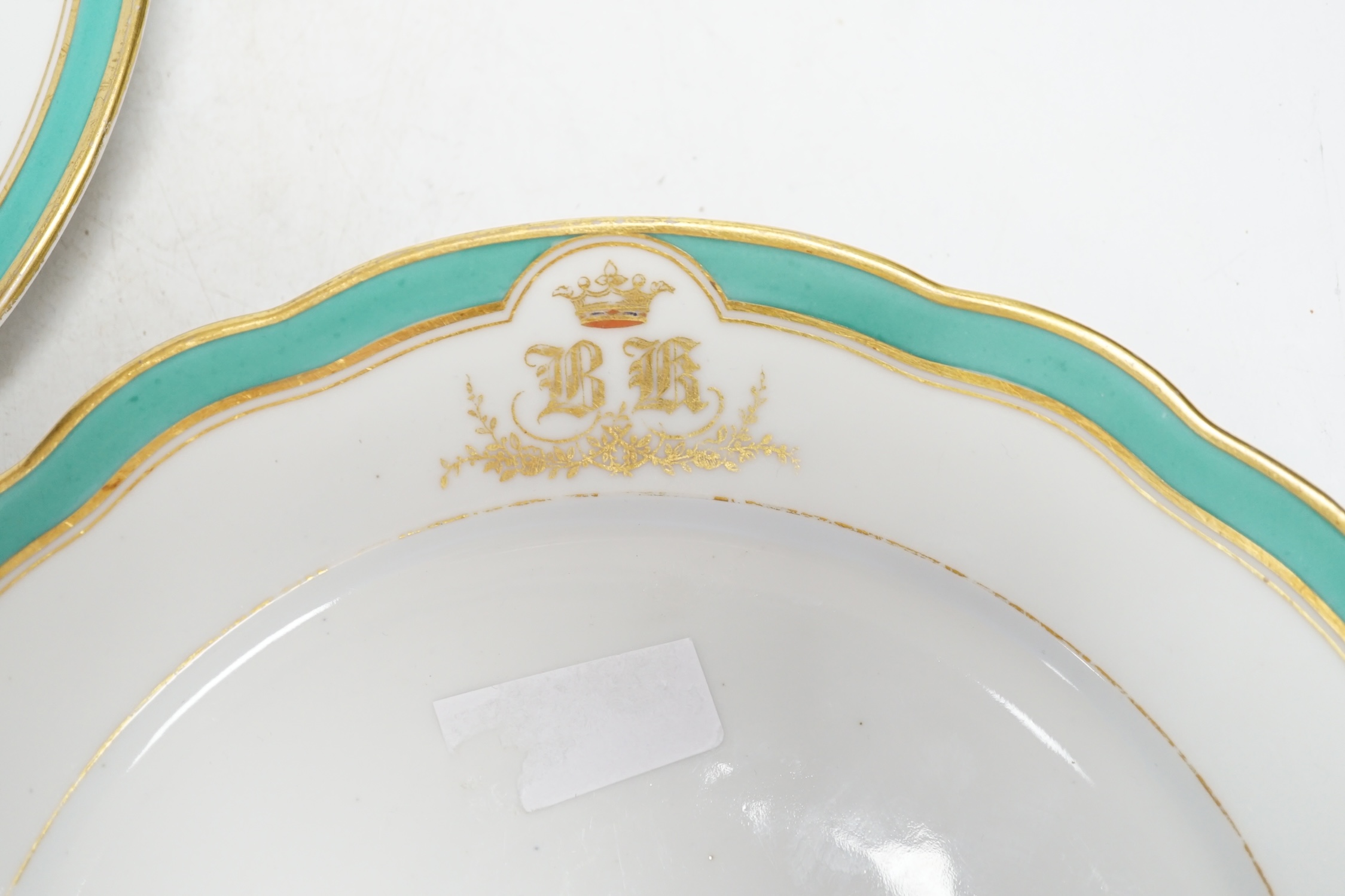 A pair of Russian Imperial Porcelain Factory plates with Alexander cipher to the reverse and crowned gilt monogram ‘BK’ to edge, 25cm diameter